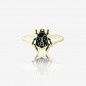 przypinka w kształcie czarnego owada ze skrzydełkami - skarabeusza