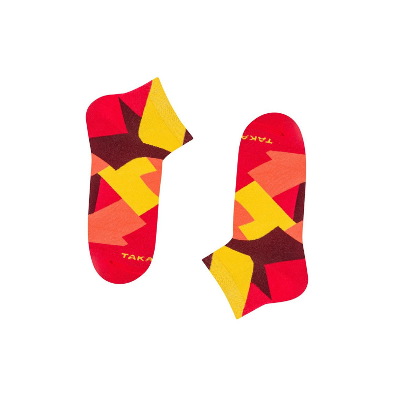 czerwono-żółte stopki w nakładające się na siebie prostokąty